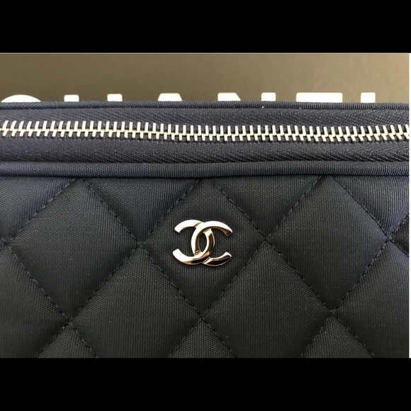 CHANEL Handbags - Chanel clutch dark cc logo blue quilted laptop bag
